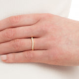 Shaped Diamond & Yellow Gold Wedding Ring on hand