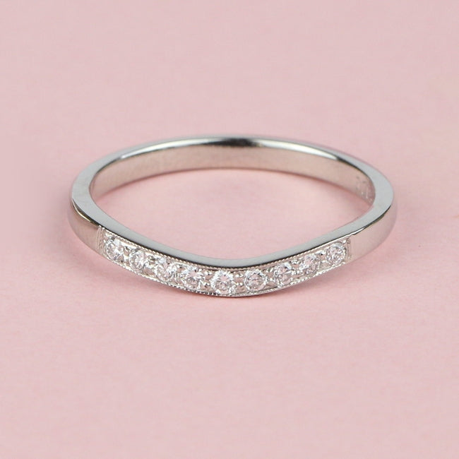 Shaped diamond wedding ring with nine diamonds