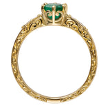 Round emerald ring in yellow gold