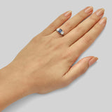 Three stone emerald-cut diamond and sapphire engagement ring