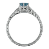 Aquamarine engagement ring with hand engraving in platinum