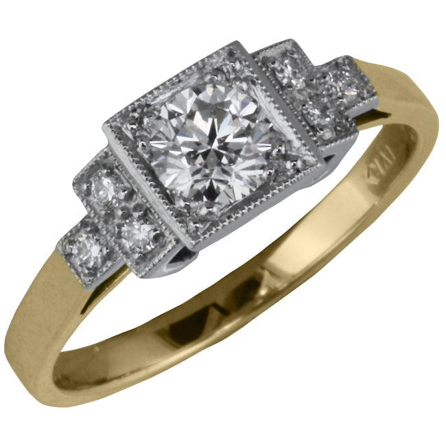 Diamonds set in platinum leading to a yellow gold band.
