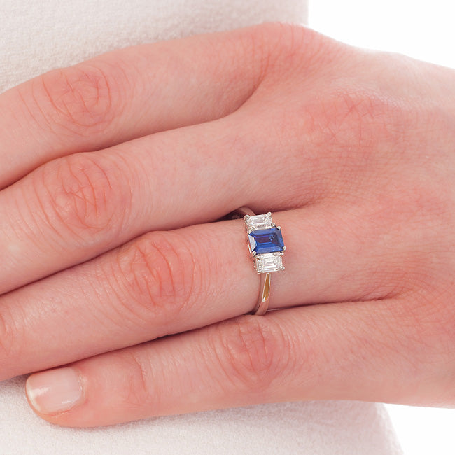 Sapphire and diamond trilogy ring on hand
