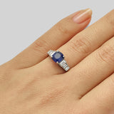 Cushion cut blue sapphire and diamond baguette engagement ring