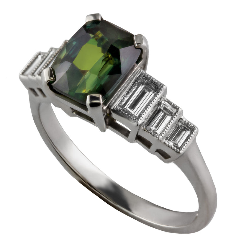 Green sapphire engagement ring with baguette diamonds
