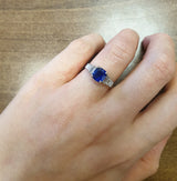 Blue sapphire ring with baguettes on hand