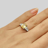 Yellow sapphire ring on hand
