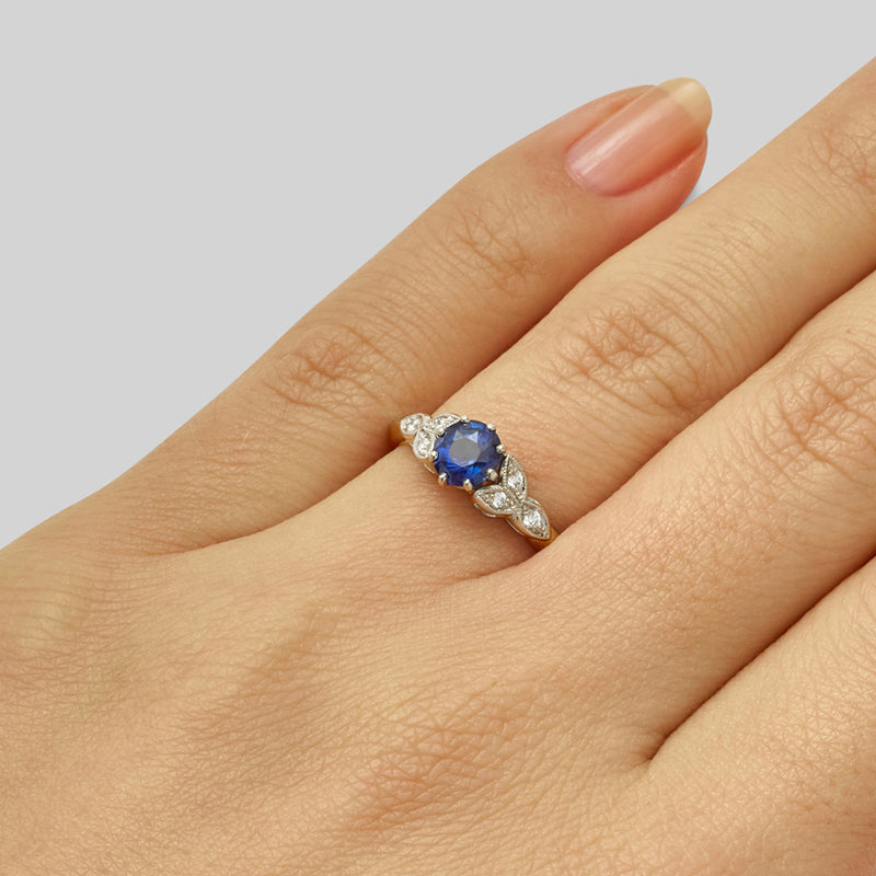 Sapphire diamond engagement ring in flower design