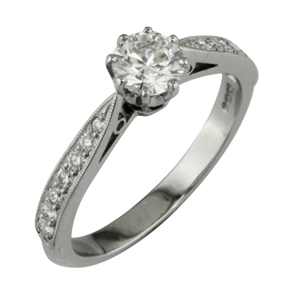 Diamond band with millegrain edging for an elegant vintage style engagement ring.