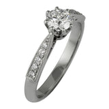 Vintage style ring with diamond shoulders on a tapered band.