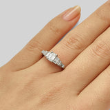 Vintage emerald cut diamond ring with baguettes
