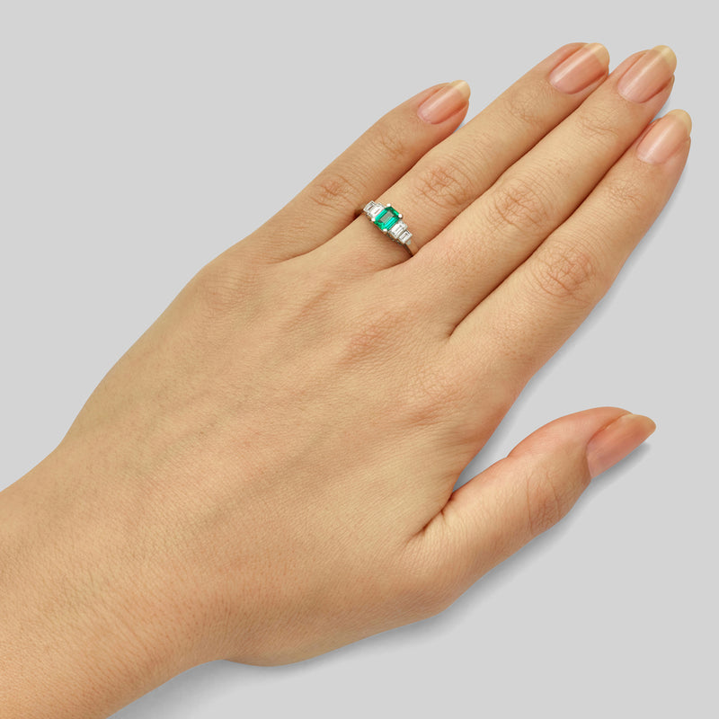 Vintage emerald engagement ring on model