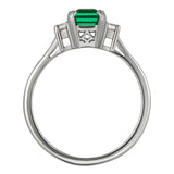 Emerald and diamond trilogy ring in platinum