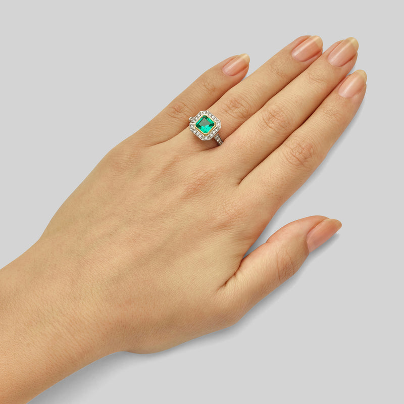 Emerald halo engagement ring