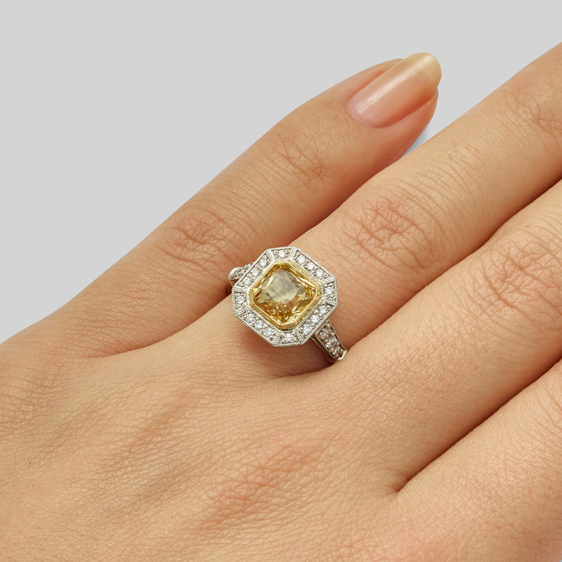 Yellow sapphire halo ring with diamonds