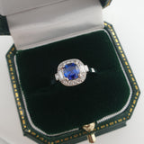 Sapphire diamond cluster ring with baguettes in box