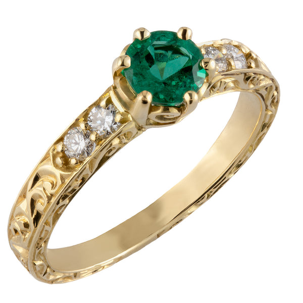 Patterned emerald engagement ring in yellow gold