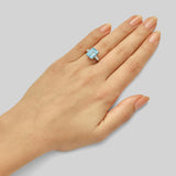 Aquamarine emerald cut ring with baguette diamonds in platinum