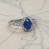 Oval sapphire cluster ring on paper