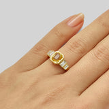 Yellow sapphire engagement ring with diamond baguettes and gold band