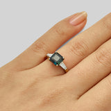 Art Deco teal sapphire engagement ring on hand