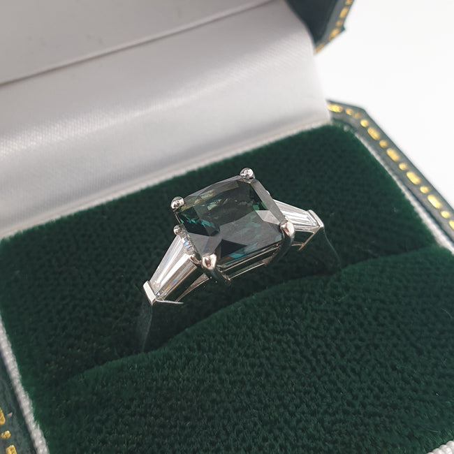 Teal sapphire engagement ring in box