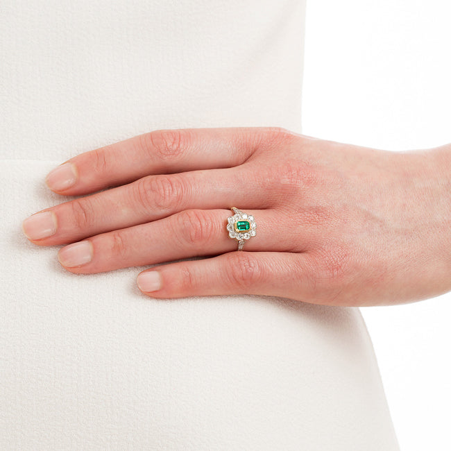 Emerald and diamond ring on hand