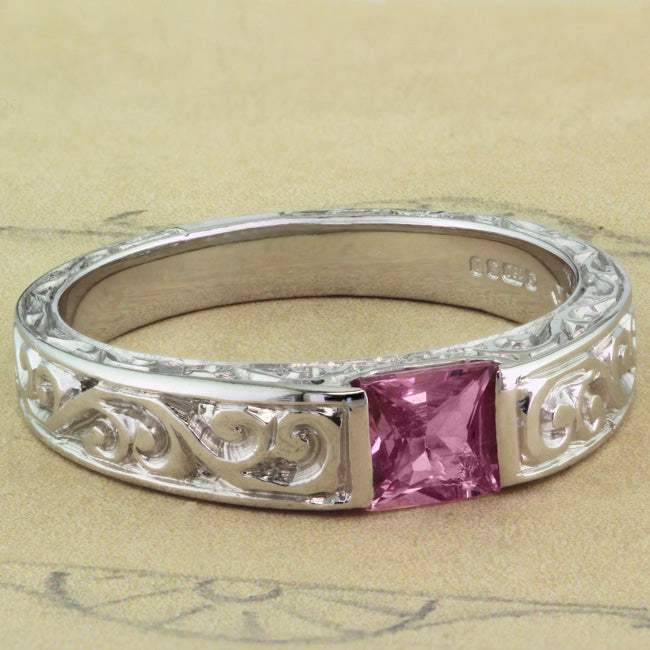 Wide band pink sapphire ring