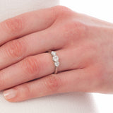 Diamond three stone ring on hand