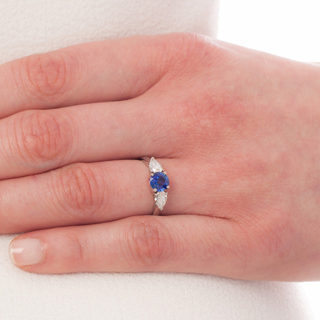 Sapphire and diamond 3 stone ring on hand