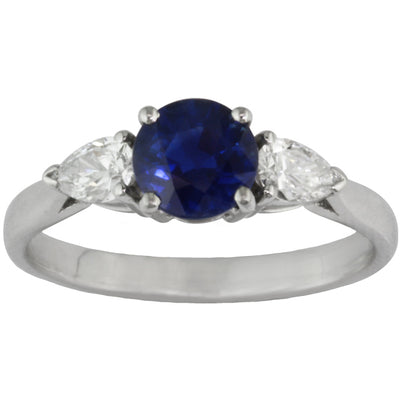 Sapphire engagement ring with pear diamond side stones