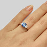 Vintage emerald cut sapphire engagement rings with diamond side stones