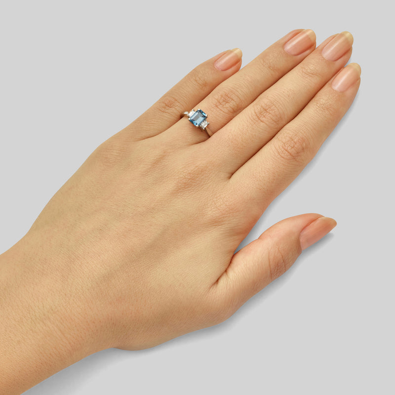 Art deco three stone aquamarine ring with emerald cut diamonds