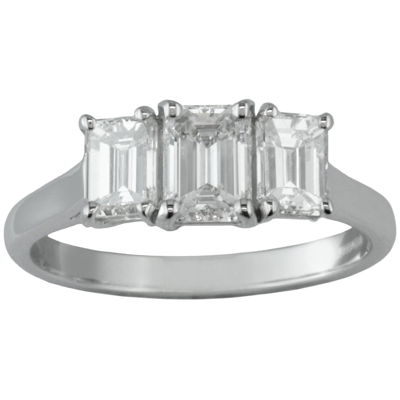 Three stone emerald cut diamond ring in platinum