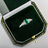 Emerald and baguette diamond five stone ring in box