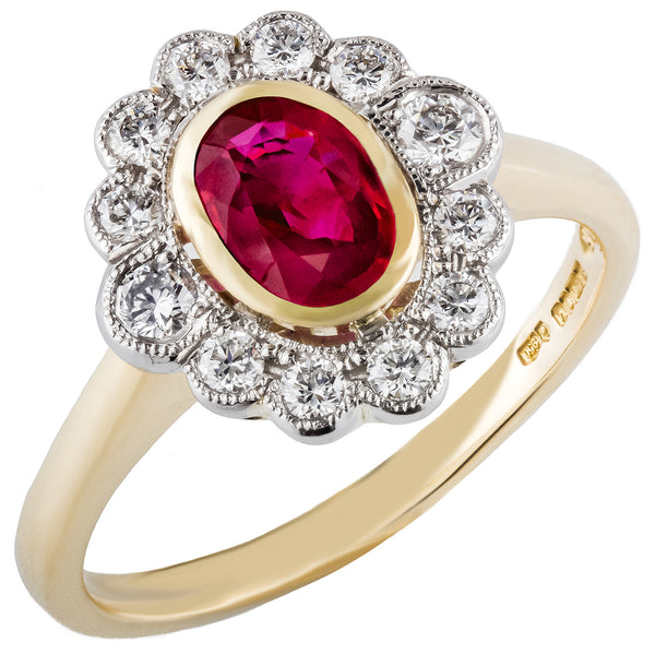 Oval ruby and diamond cluster ring in yellow gold