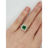 Art Deco emerald cluster engagement ring on hand