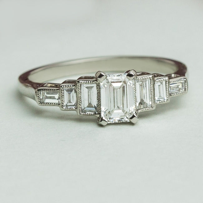 Art Deco seven stone emerald cut ring