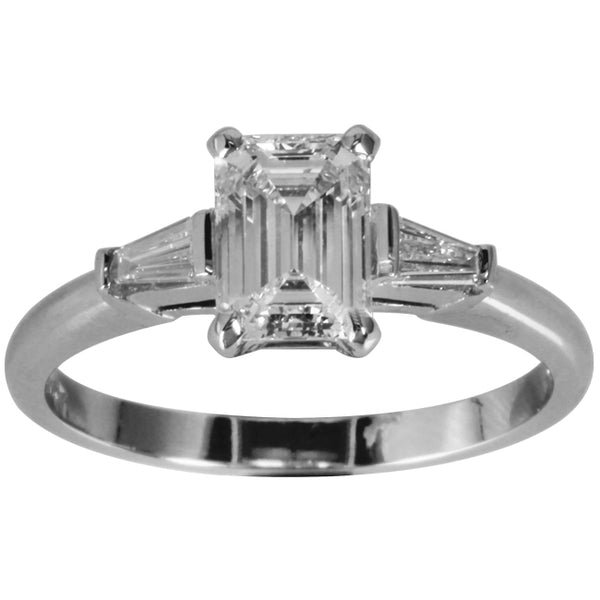 Bespoke emerald cut engagement ring with tapered baguettes