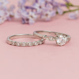 Delicate vintage engagement ring with wedding ring