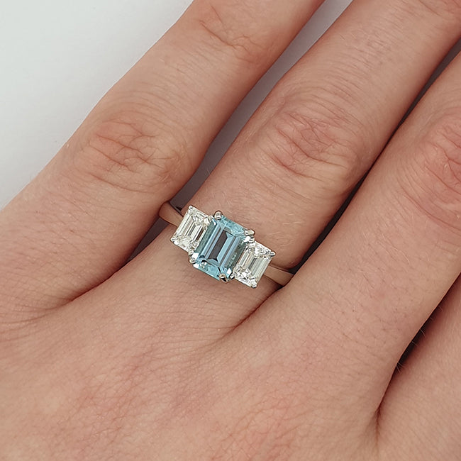 Emerald cut aquamarine and diamond trilogy ring