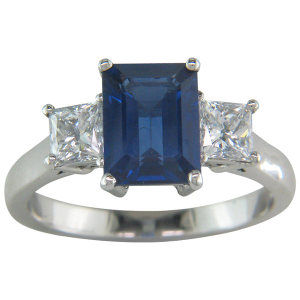Bespoke emerald cut sapphire and diamond three stone ring