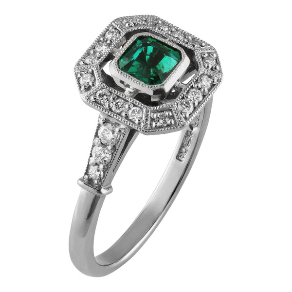 Emerald and diamond halo cluster ring in platinum