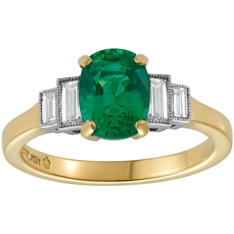 Emerald engagement ring with baguette diamonds in yellow gold