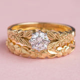 Floral matching bridal rings in yellow gold