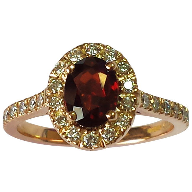 Garnet and diamond cluster engagement ring in rose gold