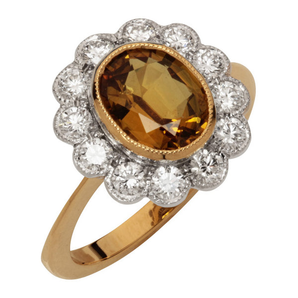Golden sapphire cluster ring in yellow gold and platinum