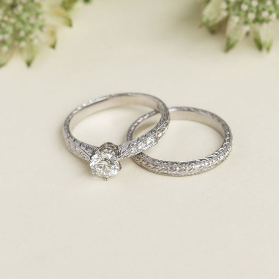 Hand engraved engagement ring and wedding ring with the laurel pattern