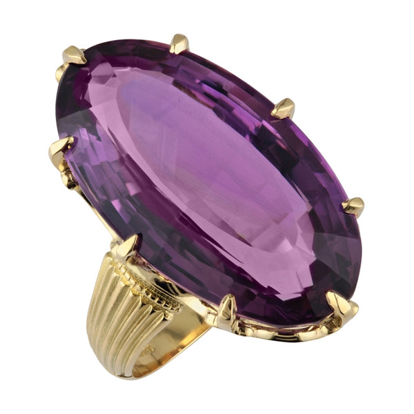 Oval amethyst dress ring in yellow gold
