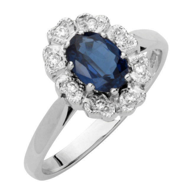 Oval blue sapphire cluster ring in platinum